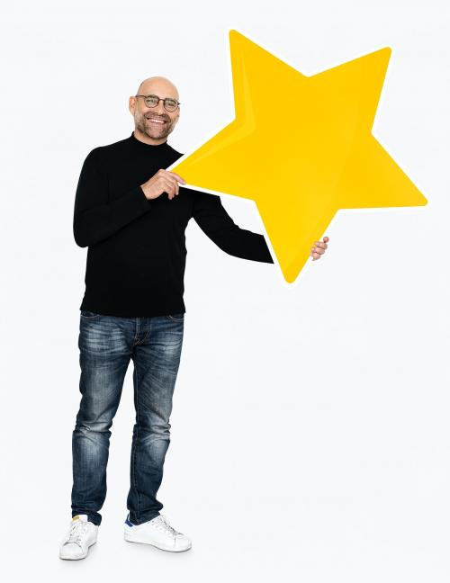 A cheerful man holding a star icon - 475147