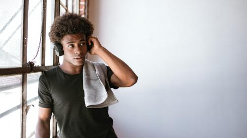 African American boy enjoying post workout music session - 1225113