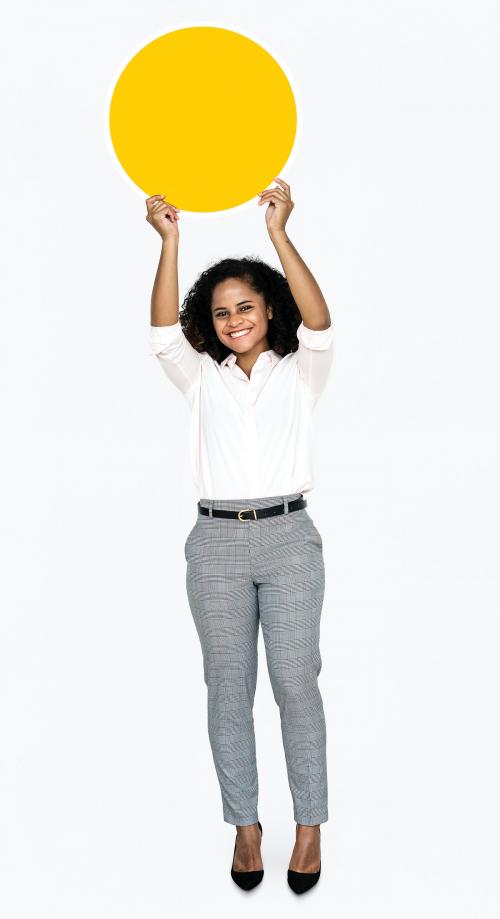 Cheerful woman holding a round yellow board - 475188