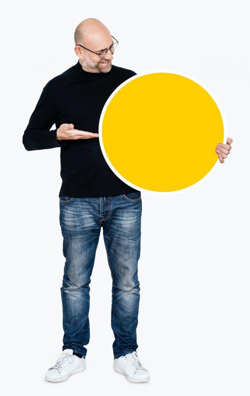 Happy man holding round yellow board - 475269