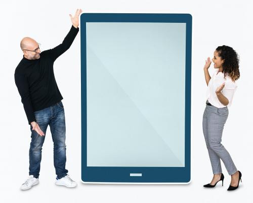 Cheerful people standing beside a tablet - 475396