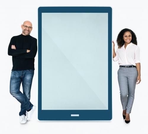 Cheerful people standing beside a tablet - 475473