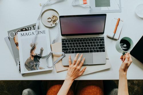 Female blogger working on her laptop at home - 1220996