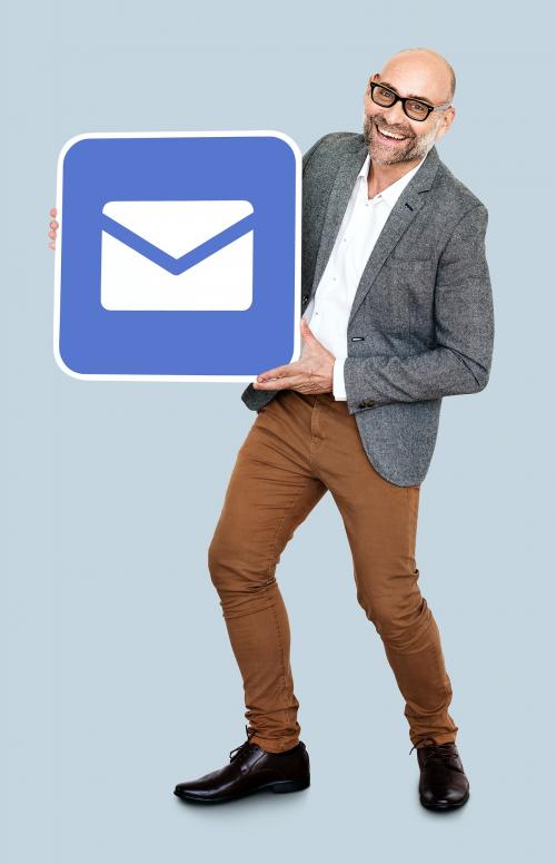 Mature man holding an email icon - 470554