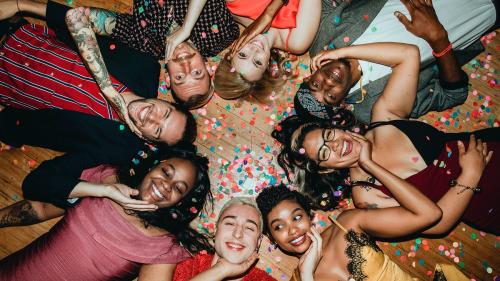 Group of friends lying on the floor at a party - 1225230