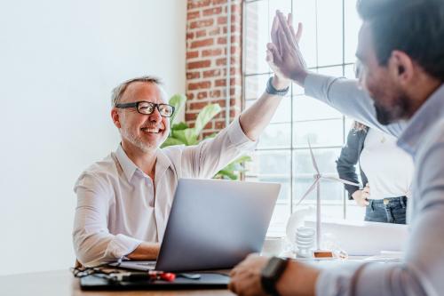 Business people giving a high five - 1233783