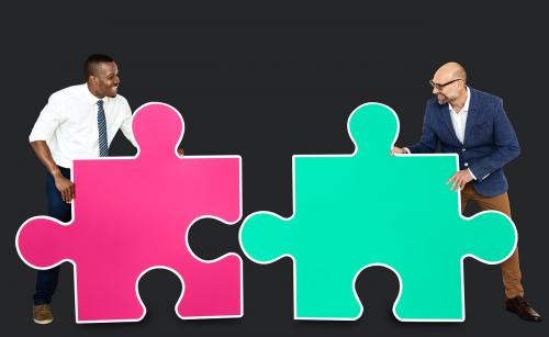 Two men connecting puzzle pieces - 470747