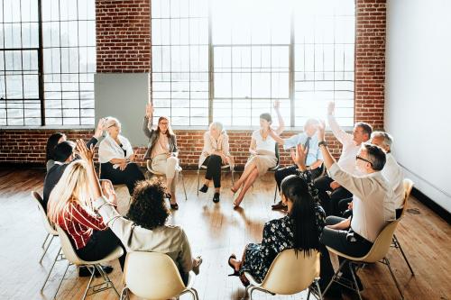 People sitting and talking with a group - 2019878