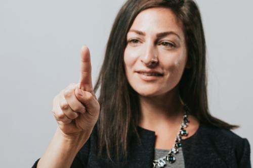 Happy businesswoman in a studio - 2020062