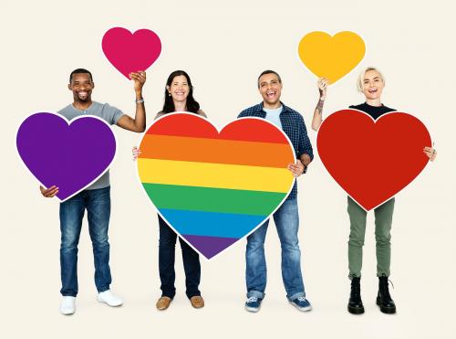 Group of people holding colorful hearts - 469351