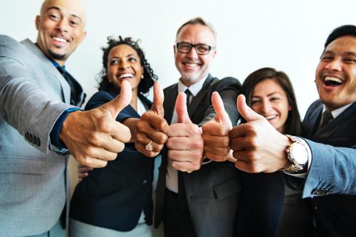 Businesspeople doing a thumbs up together - 1217967