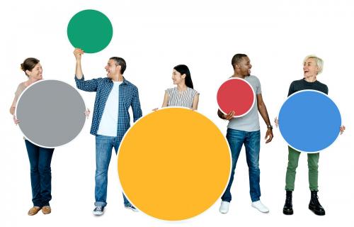 Happy people holding colorful round boards - 469512