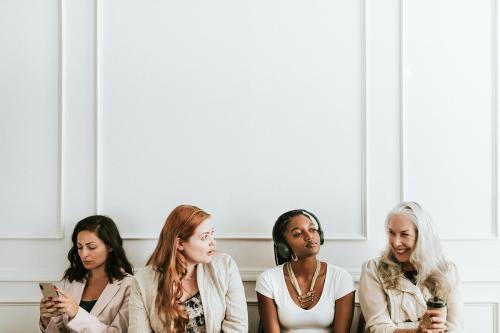 Happy businesswomen using digital devices - 1224230