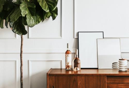 Wooden table against a white wall - 1224504