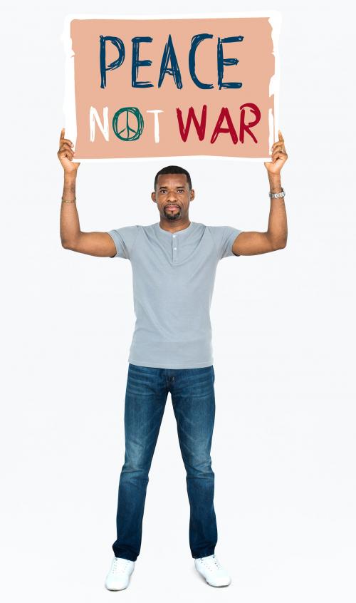 An African man holding peace not war signboard - 469609