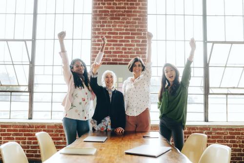 Cheerful successful woman in the office - 1226509