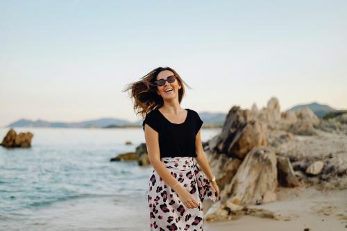 Girl walking along the beach - 1228435