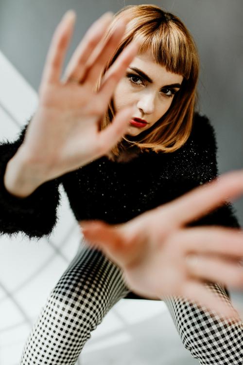 Short brown hair woman in a studio shoot - 1235398