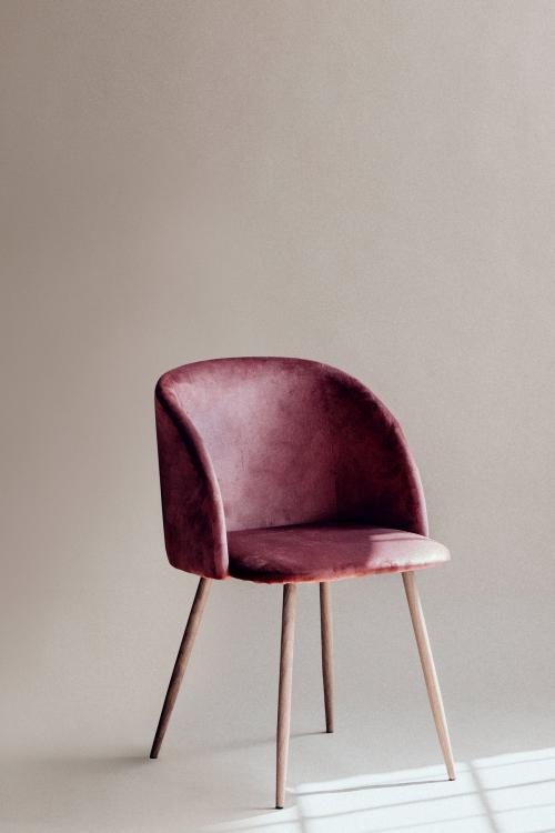 Pink chair by a white wall - 1235516