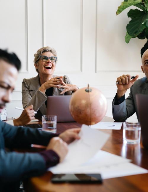 Happy senior woman in a business meeting - 1216714