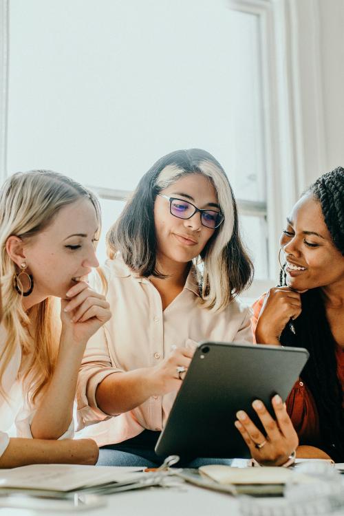 Businesswomen using a digital tablet in a meeting - 1220744