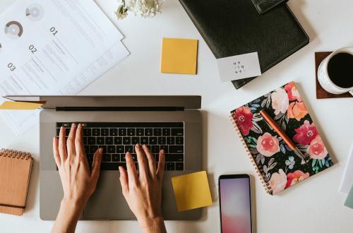 Female blogger working on her laptop at home - 1220784