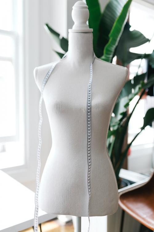 Measuring tape on a dummy mannequin - 1220995