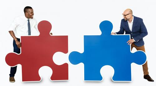 Two men connecting puzzle pieces - 468385