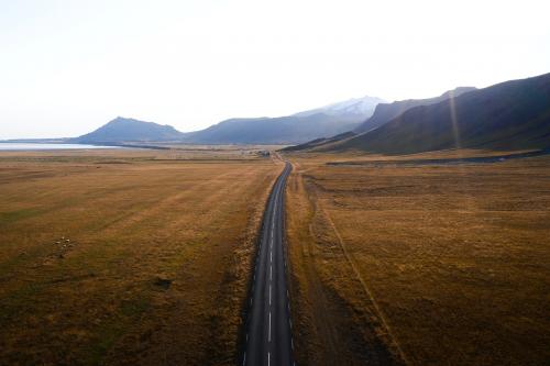 Road on the countryside on a misty day drone shot - 1227124