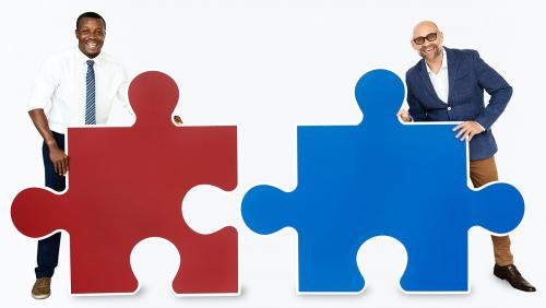 Two men connecting puzzle pieces - 468469