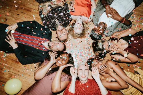 Group of friends lying on the floor at a party - 1225201