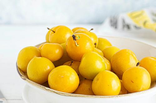 Fresh organic mirabelle plums in a bowl - 1225285