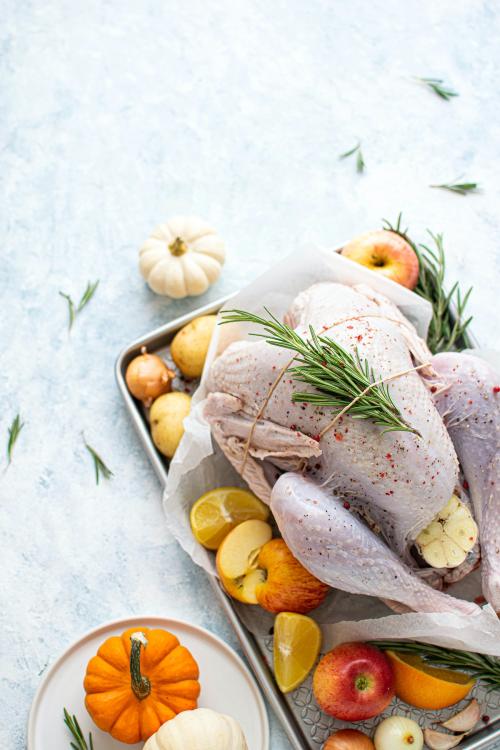 Raw turkey with fresh rosemary - 1228638