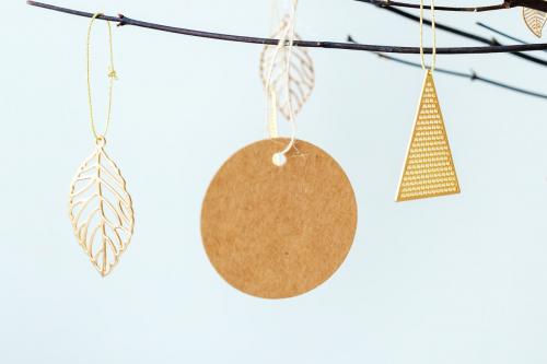 Festive golden Christmas ornaments on a branch - 1231403