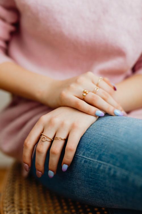 Closeup of painted nails and rings on her fingers - 1231991