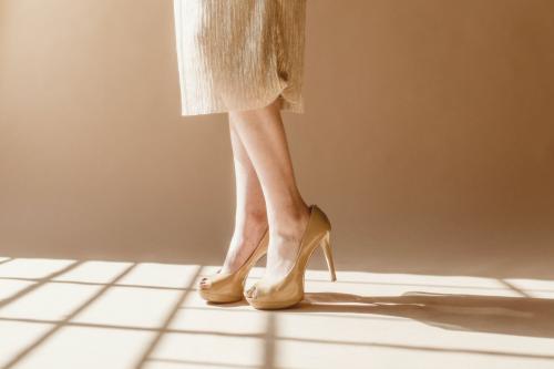 Fashionable woman wearing creamy heels - 1235464