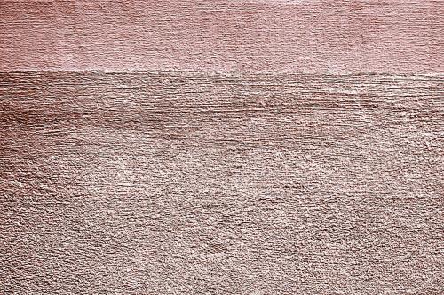 Roughly pink gold painted concrete wall surface background - 596847