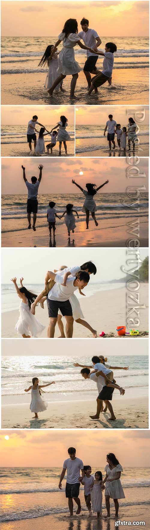 Happy family enjoy vacation on beach in evening