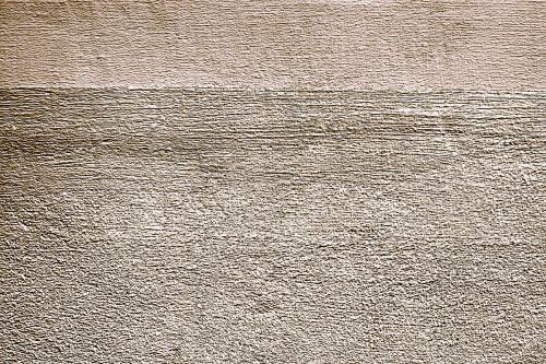 Roughly gold painted concrete wall surface background - 596889