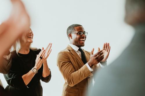 Diverse business people applauding with joy - 1217971