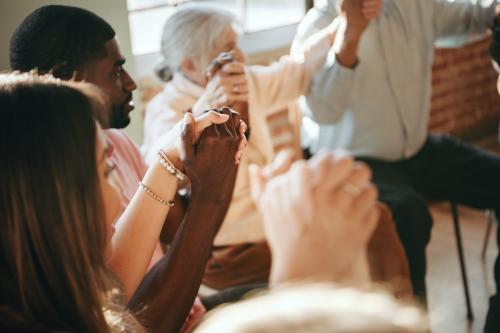 Group of diverse people holding hands up in the air - 1223845