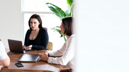 Businesswoman using laptop in a meeting - 1225004