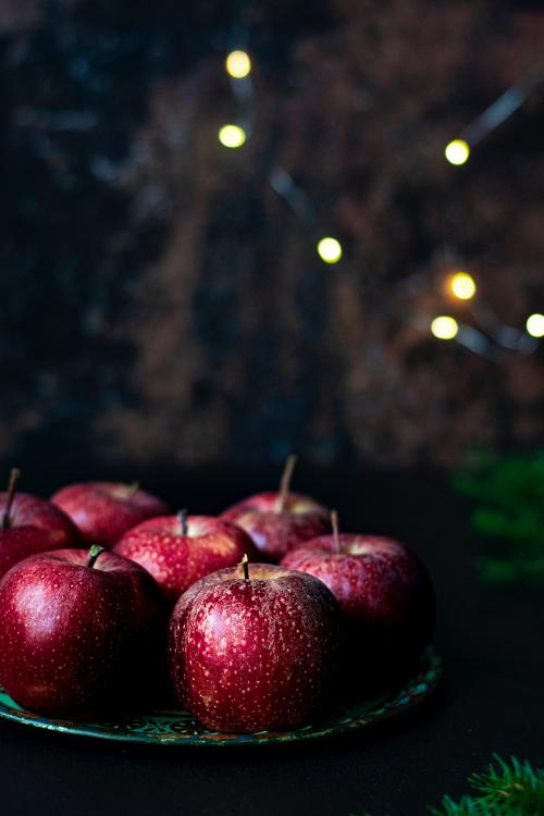 Fresh red apples on a plate - 1228648