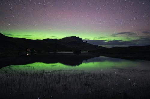 Aurora borealis over the Isle of Skye in Scotland - 1233460