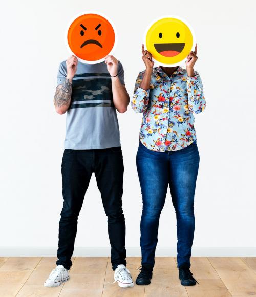 Couple holding an expressive emoticon face - 414636