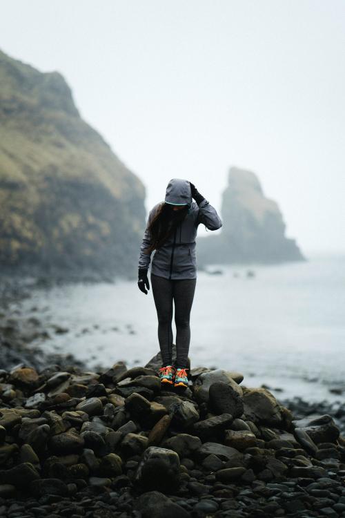 Woman at a rocky shore at Spar Cave, Isle of Skye - 935884