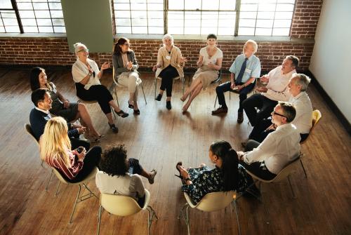 People sitting and talking with a group - 1218035