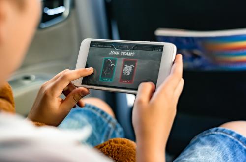 Boy playing on a smartphone in the car - 431094