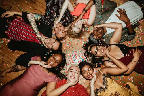 Group of friends lying on the floor at a party - 1225191