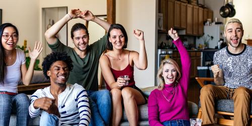 Friends watching a game show on the tv - 1226983